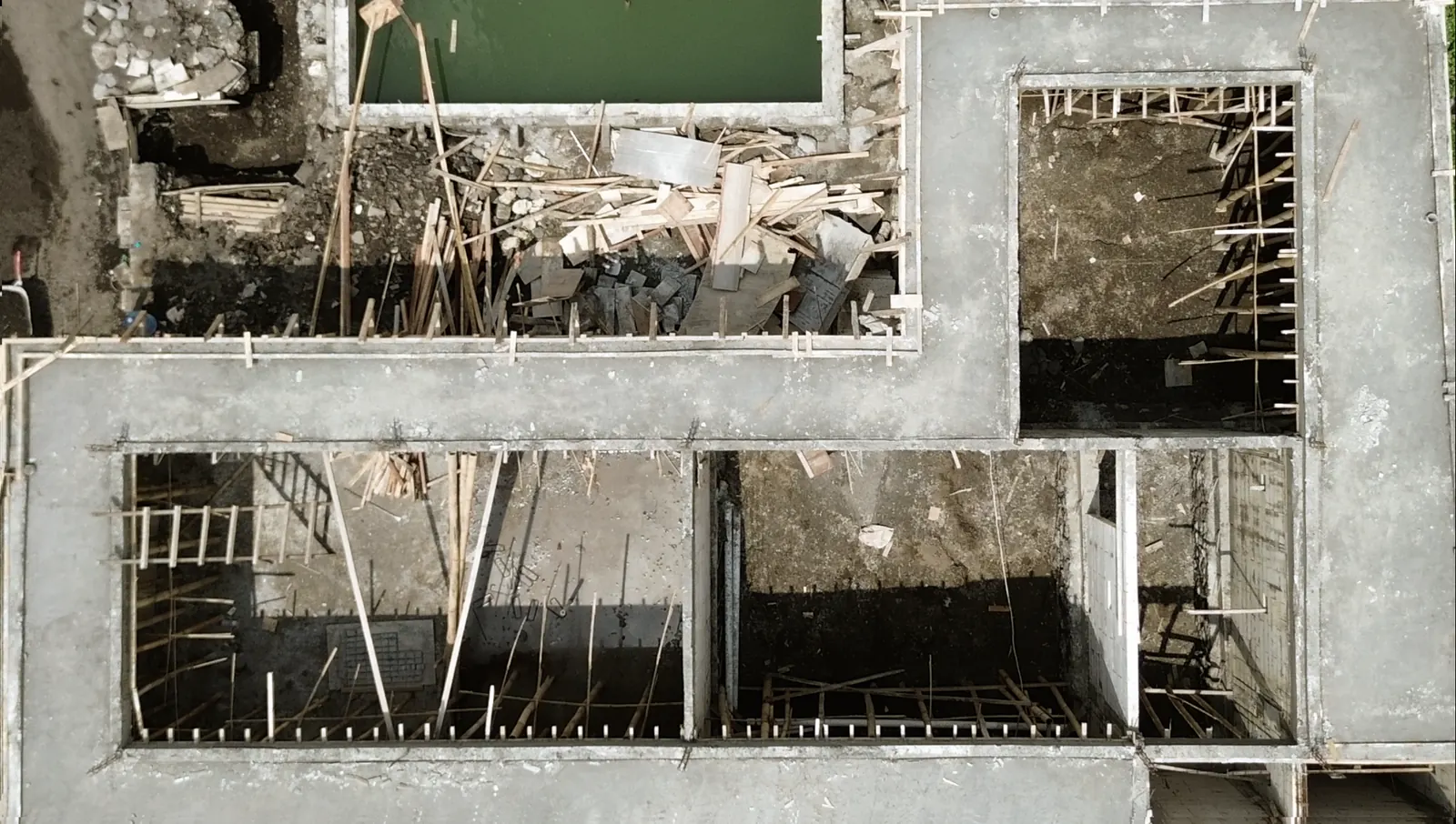 An aerial view of foundations and ground floor walls on a building site