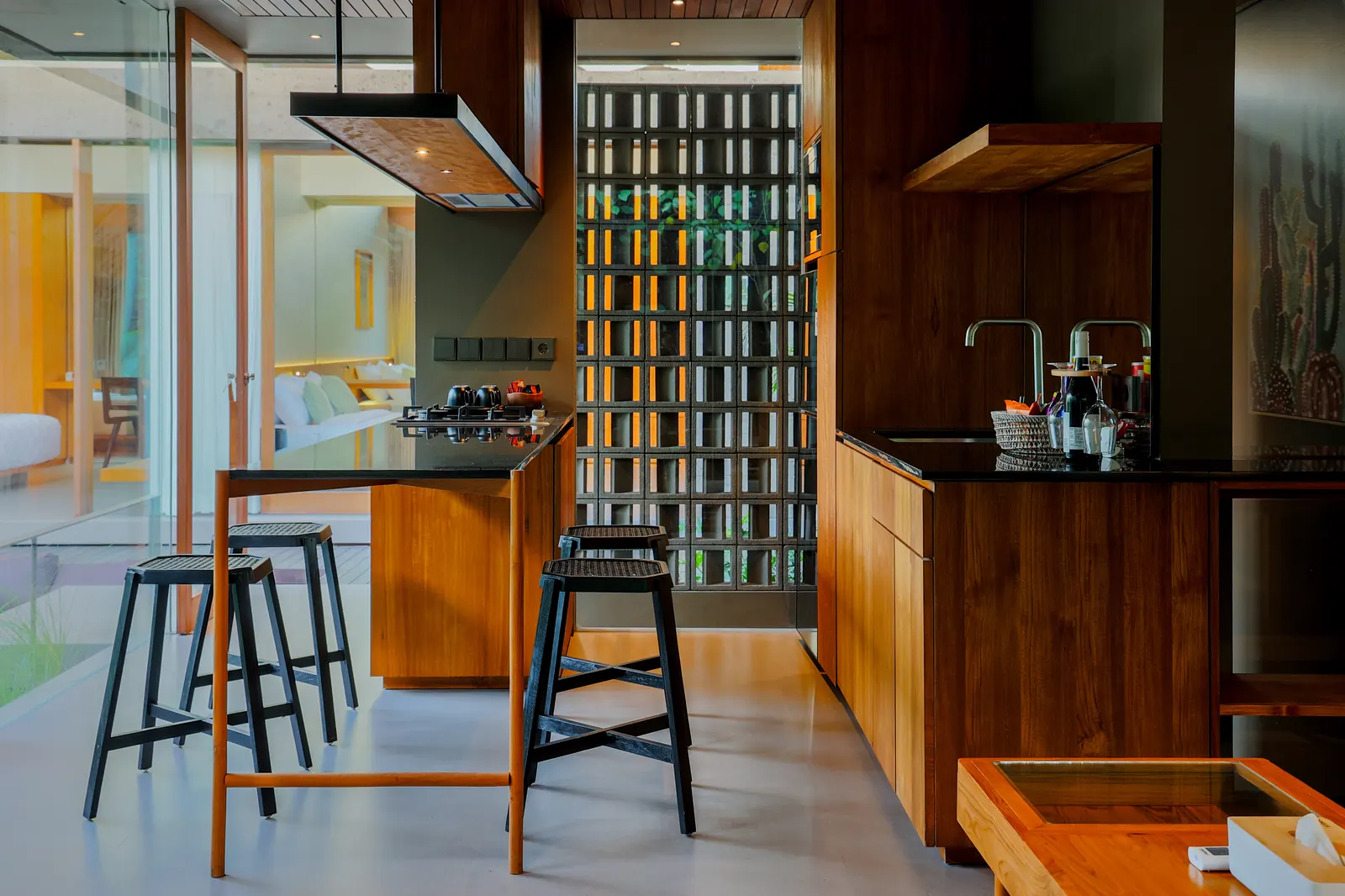A timber kitchen with a breakfast counter and stools
